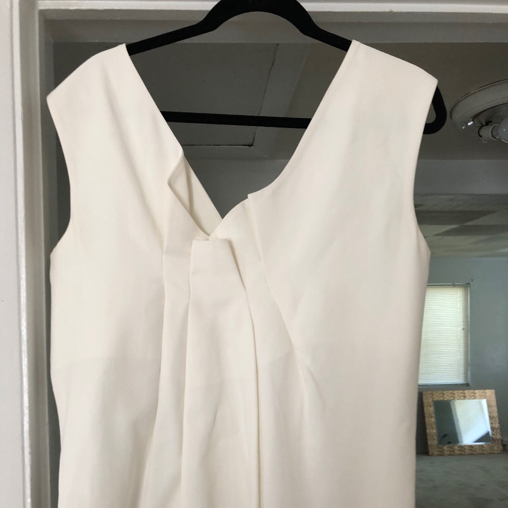 White COS top with intricate draping in back